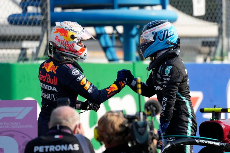 Mercedes driver Valtteri Bottas, right, with Red Bull driver Max Verstappen after the Sprint Race qualifying session at Monza. AP