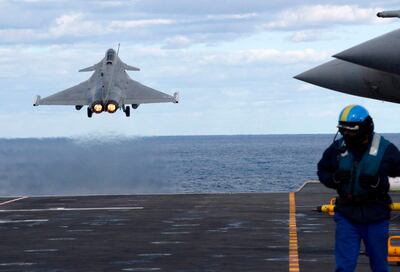 (FILES) In this file photo taken on February 10, 2020 A French Rafale fighter jet is catapulted from the French aircraft carrier, Charles de Gaulle, off the eastern coast of Cyprus in the Mediterranean Sea. France is pulling out of a NATO Mediterranean maritime security operation until it gets a response to its concerns over the behaviour of fellow member Turkey, a French defence official said Wednesday. "We have decided to temporarily withdraw our assets from the operation Sea Guardian" until France's concerns are addressed, the official, who asked not to be named, told reporters. The decision follows an escalation in tensions with Turkey over the Libya conflict. / AFP / Mario GOLDMAN
