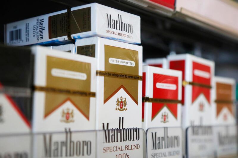 Packs of Marlboro cigarettes are displayed for sale at a convenience store in Somerville, Massachusetts July 17, 2014.  Cigarette maker Philip Morris International Inc cut its earnings forecast for 2014 and said it is proving to be a "complex and truly atypical" year for the company.    REUTERS/Brian Snyder    (UNITED STATES - Tags: HEALTH BUSINESS)