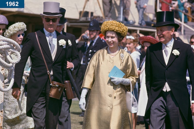 1962: The queen attends the races at Epsom Downs Racecourse in Surrey.