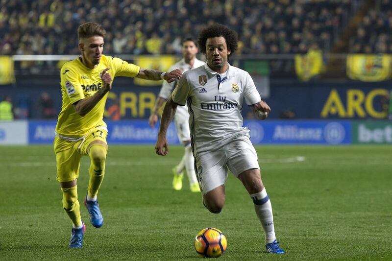 Real Madrid defender Marcelo, right, escapes from Villarreal midfielder Samu Castillejo. Domenech Castello / EPA