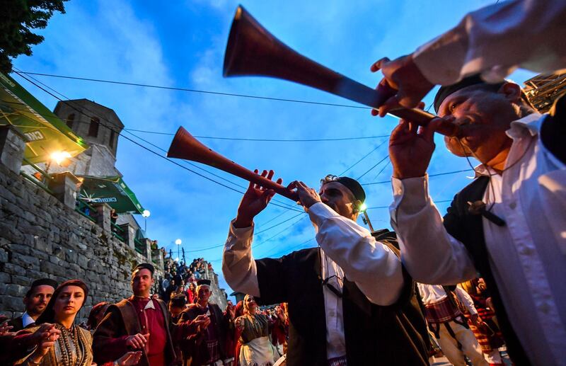 epa07715263 The musicians perform the night before a wedding ceremony in the village of Galicnik some 150 km west of the capital Skopje, Republic of North Macedonia on 13 July 2019. Every year the villagers of Galicnik celebrate a public summer wedding on the Orthodox day of the Patron Saint Petrovden (St. Peter's day). In this centuries-old tradition many rituals such as music and dances are performed.  EPA/GEORGI LICOVSKI