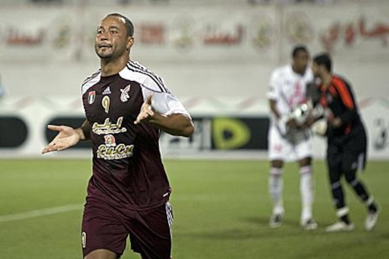 Fernando Baiano, Wahda's hat-trick hero, celebrates scoring his first to send the Abu Dhabi club on their way to the title.