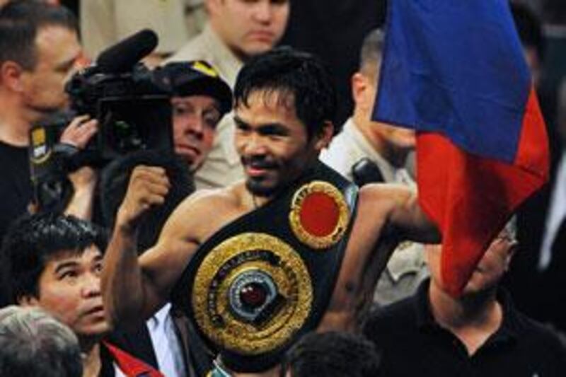 Manny Pacquiao celebrates after knocking out Ricky Hatton of England to win their Welterweight title fight in May.