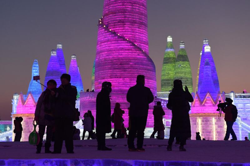 People visit the  Harbin Ice and Snow Sculpture Festival in Harbin in China's northeast Heilongjiang provinc. Greg Baker / AFP Photo