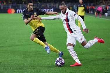 Achraf Hakimi, left and in action for Dortmund against PSG in the Champions League Round of 16, has joined Inter Milan from Real Madrid. Getty Images