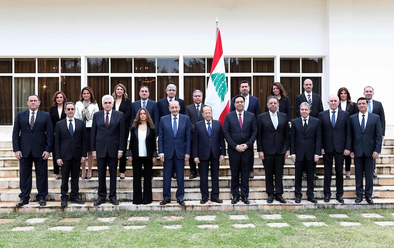Lebanon's Parliament Speaker Nabih Berri, centre left, and President Michel Aoun, centre, and prime minister designate Hassan Diab centre right, pose for a group photo with the newly formed government at the presidential palace in Baabda, east of the capital Beirut, on January 22, 2020. AFP
