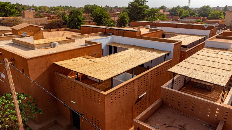 Niamey 2000, Niamey, Niger. As a response to a housing shortage amid rapid urban expansion, this prototype housing of six family units seeks to increase density while remaining culturally appropriate.