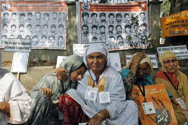 Relatives of missing Kashmiri youths participate in a protest organized by the Association of Parents of Disappeared Persons (APDP) in Srinagar, India. Mukhtar Khan / AP Photo