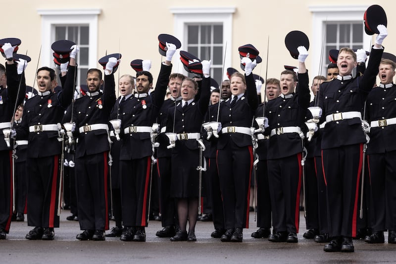 Officer Cadets give three cheers to the king. PA