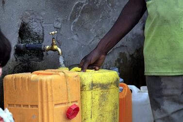 Containers being filled with water in Yemen. Some 70 per cent of the Mena region's GDP is exposed to high or very high water stress, according to the World Resource Institute . EPA