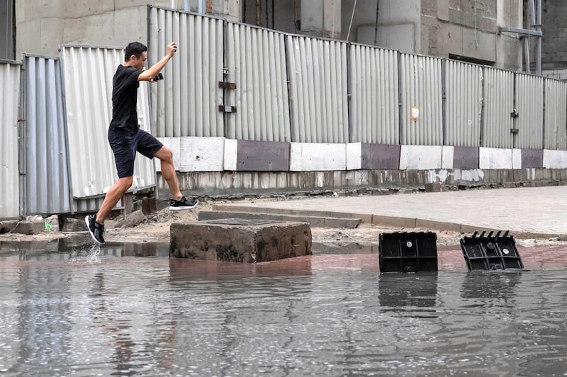 DUBAI, UNITED ARAB EMIRATES. 10 JANUARY 2020. Heavy rains in Dubai during the night had residenst wake up to wet pavements and large water puddles with some areas experiencng mild flooding. Barsha Heights saw a medium amount of flooding that still proved challenging to morning commuters. (Photo: Antonie Robertson/The National) Journalist: Standalone. Section: National.

