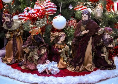 A sculpted scene from the Nativity story under the Christmas tree in the Bracho residence. Victor Besa / The National