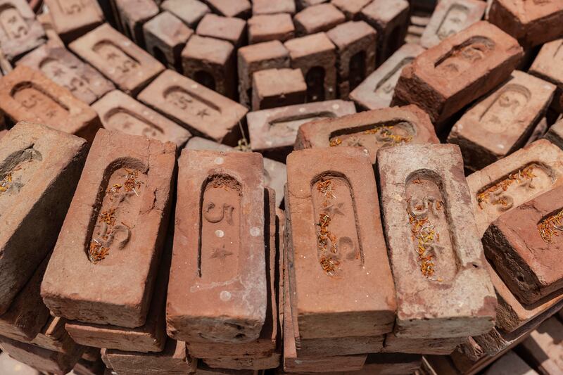 Bricks from India donated by the Hindu community are used in the temple's foundations.
