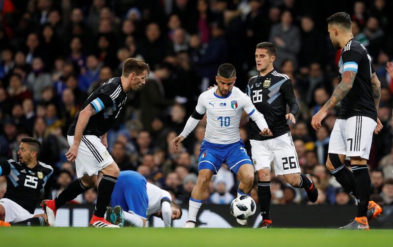 Soccer Football - International Friendly - Italy vs Argentina - Etihad Stadium, Manchester, Britain - March 23, 2018   Italy’s Lorenzo Insigne in action with Argentina’s Lucas Biglia and Fabricio Bustos    REUTERS/Phil Noble