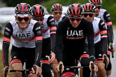 Team UAE Emirates' Tadej Pogacar of Slovenia (3rd-R) attends a training session two days ahead of the first stage of the 108th edition of the Tour de France cycling race, near Brest on July 24, 2021. / AFP / Anne-Christine POUJOULAT