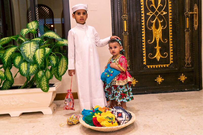 Lulua and her brother Rashid are ready for their ‘Garangao’ night, dressed in vibrant outfits and jewelry. Doha, Qatar 2023. Olga Stefatou for The National