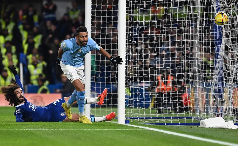 Manchester City's Algerian midfielder Riyad Mahrez celebrates scoring the opening goal during the English Premier League football match between Chelsea and Manchester City at Stamford Bridge in London on January 5, 2023.  (Photo by Glyn KIRK / IKIMAGES / AFP) / RESTRICTED TO EDITORIAL USE.  No use with unauthorized audio, video, data, fixture lists, club/league logos or 'live' services.  Online in-match use limited to 45 images, no video emulation.  No use in betting, games or single club/league/player publications. 