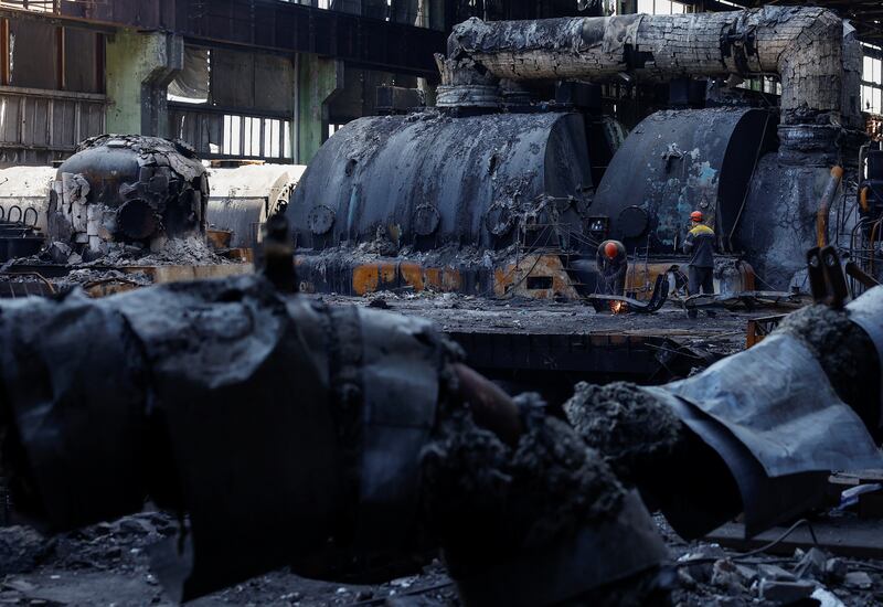 Engineers at a Ukrainian thermal power plant heavily damaged by recent Russian missile strikes. Reuters
