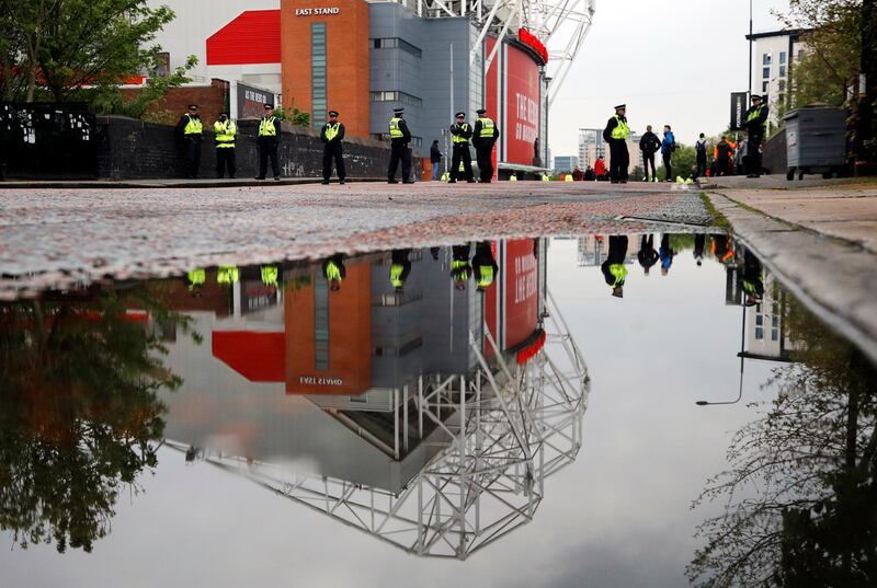 Police officers and stewards outside Old Trafford on Thursday. Reuters