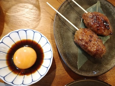 Wagyu tsukune with egg yolk in soy sauce