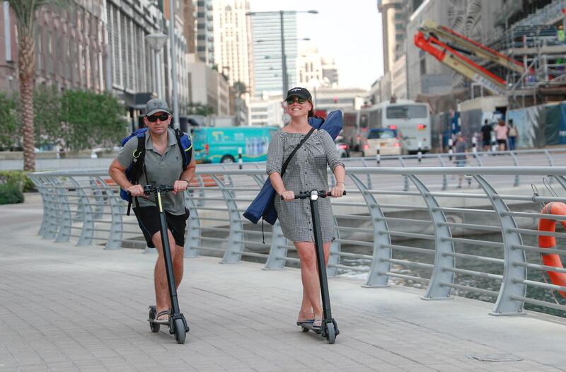 Dubai, United Arab Emirates, August 24, 2019.  - Dubai Marina residents get bitten by the e-scooter bug.
Victor Besa/The National
Section:  Standalone
Reporter: