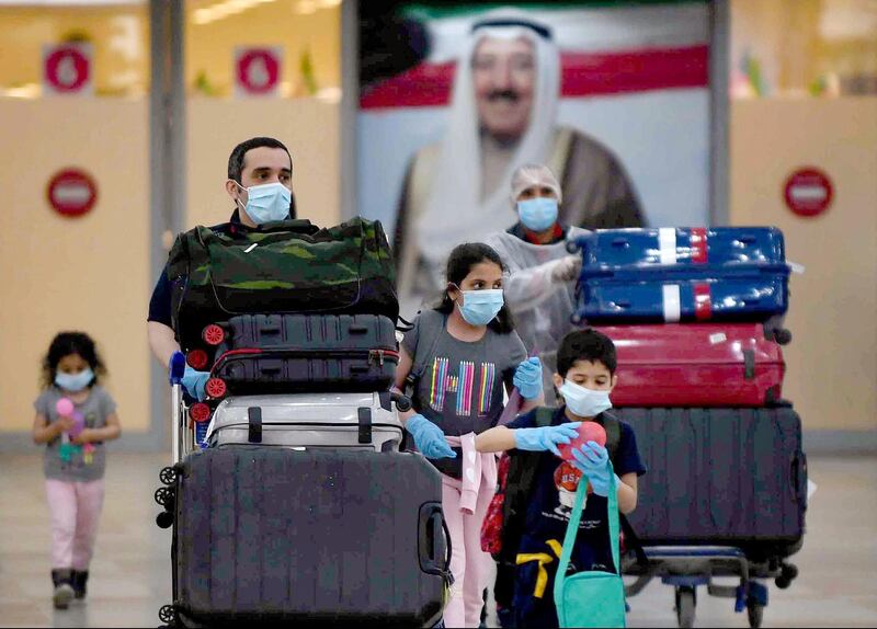 Kuwaiti nationals arrive at the Kuwait International Airport, south of the capital Kuwait City, after a repatriation plan for citizens stranded abroad was put together by the authorities, during the novel coronavirus crisis. AFP