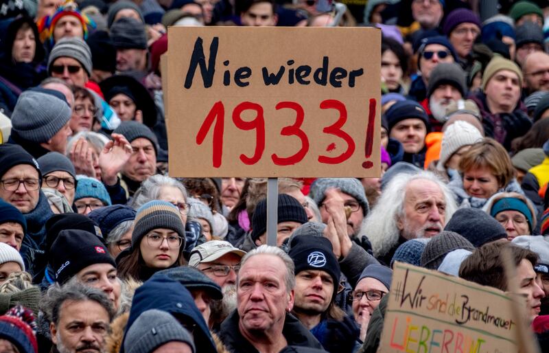 A 'never again 1933' poster is held up in Frankfurt at a protest against the AfD party and right-wing extremism on Saturday. AP