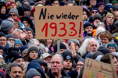 People gather as they protest against the AfD party and right-wing extremism in Frankfurt/Main, Germany, Saturday, Jan.  20, 2024.  Sign reads "never again 1933".  (AP Photo / Michael Probst)