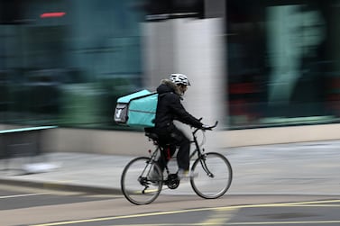 A Deliveroo rider in London. The company now expects to be listed at a market value between £7.6 billion and £7.85bn. AFP