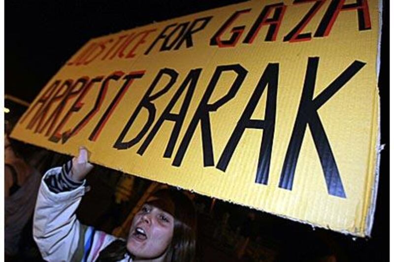 A woman demands the arrest of the Israeli defence minister, Ehud Barak, during a demonstration against his visit to the British Labour Party's annual conference in Brighton, England, last month. The foreign office upgraded Mr Barak's visit from private to official to give him diplomatic immunity.