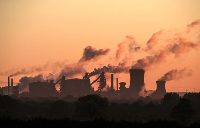 (FILES) In this file photo taken on May 22, 2019 British Steel's Scunthorpe plant is pictured at dawn in north Lincolnshire, north east England. As a consequence of Brexit, the United Kingdom launched its own CO2 market in May 2021, when it had previously been integrated into the European market.  / AFP / Lindsey Parnaby / TO GO WITH AFP STORY BY Veronique DUPONT
