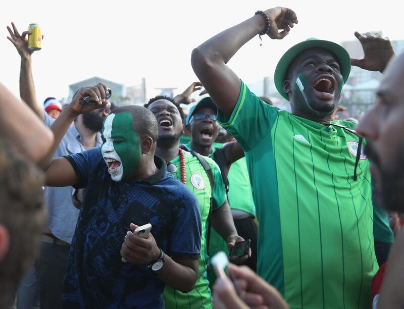 Nigerian soccer fans react at a missed scoring opportunity against Iran as they watch on a giant screen at the Fifa World Cup Fan Fest on Copacabana beach on June 16, 2014 in Rio de Janeiro, Brazil. Joe Raedle/Getty Images