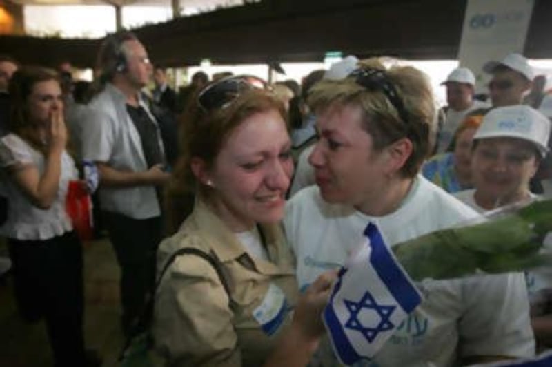 A Russian immigrant to Israel is greeted by well-wishers as she arrives at Israel's Ben Gurion airport last year.