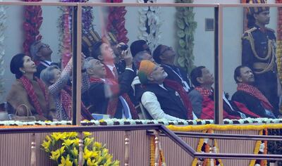 Singaporean Prime Minister Lee Hsien Loong (3L) takes photos as Indian Prime Minister Narendra Modi and others watch the fly-past during India's 69th Republic Day Parade in New Delhi on January 26, 2018. / AFP PHOTO / PRAKASH SINGH