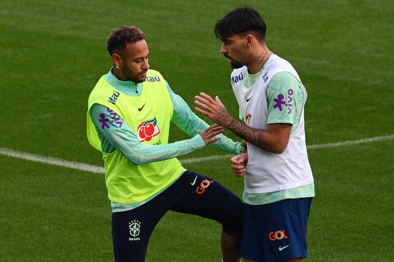 Brazil's Neymar with Lucas Paqueta during training. AFP