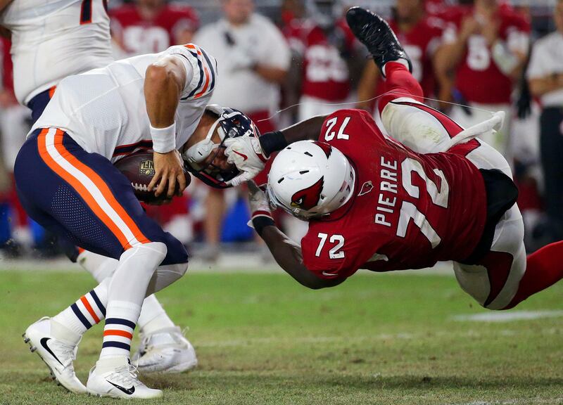 Chicago Bears quarterback Mitchell Trubisky (10) is sacked by Arizona Cardinals defensive tackle Olsen Pierre (72) during the second half of a preseason NFL football game in Glendale, Ariz. Ralph Freso / AP Photo