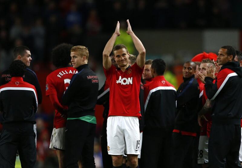 Manchester United defender Nemanja Vidic applauds the fans following his final Premier League match at Old Trafford. Darren Staples / Reuters / May 6, 2014