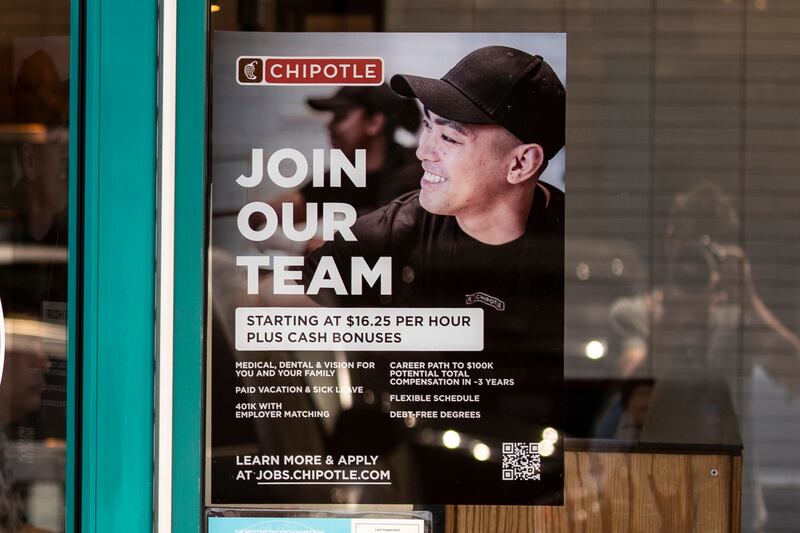 A hiring poster at a Chipotle fast food restaurant in Los Angeles, California. US unemployment stands at 3.6 per cent, about 0.1 per cent above a 50-year low in 2019. EPA