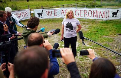 Helen Macdonald, the owner of Geronimo the alpaca, speaks to the media after the animal was taken away on a trailer to an undisclosed location. AP.