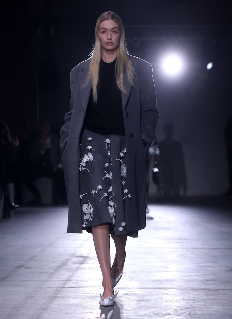 Model Gigi Hadid wears an embellished grey look at the  Prada autumn/winter 2023 show. EPA 