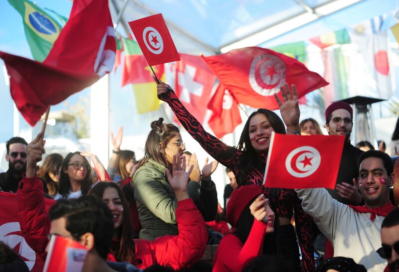 Tunisia soccer fans gather to watch their national team play against France in a World Cup Group D soccer match played in Qatar, on a large screen set up for fans in Tunis, Tunisia. AP Photo