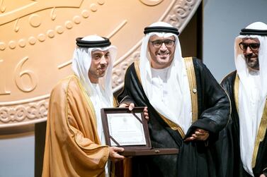 Jamal Al Suwaidi (centre) receives the Sheikh Zayed Book Award from Sheikh Mansour bin Zayed
