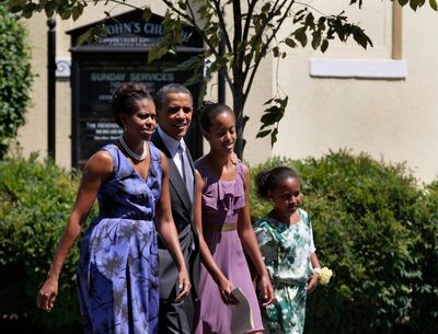 FILE - In this Sunday, July 17, 2011 file photo, President Barack Obama, second from right, walks with his family, first lady Michelle Obama, left, and their daughters Malia, third from left, and Sasha from St. John's Episcopal Church, to the White House in Washington. (AP Photo/Carolyn Kaster)