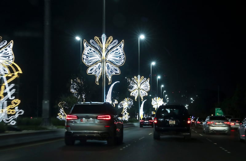 Motorists drive past Eid Al Adha lights along the Corniche.