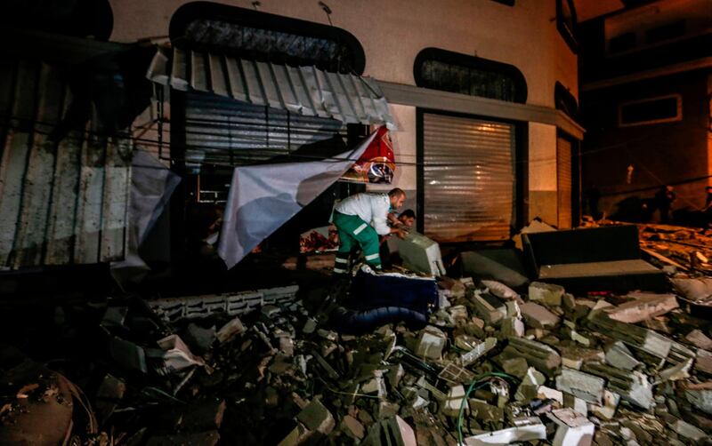 Palestinians inspect the damaged house of Islamic Jihad leader Baha Abu Al Ata afther an Israeli attack in Gaza city. AFP
