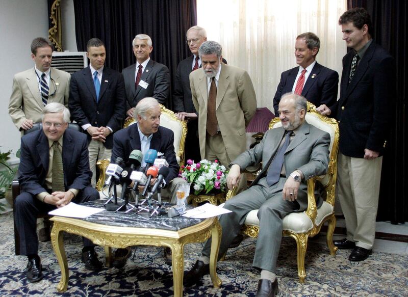 Iraqi Prime Minister Ibrahim Jaafari (seated, R) meets the press after a meeting with and Curt Weldon (L), the head of a US congressional delegation of about a half-dozen members that also includes Rep. Joe Wilson, Rep. Jeff Miller, Rep. Harold Ford, Rep. Mark Green, David Reichert, and Senator Joe Biden, in Baghdad 30 May 2005. AFP PHOTO/POOL/ALI HAIDAR (Photo by ALI HAIDAR / POOL / AFP)