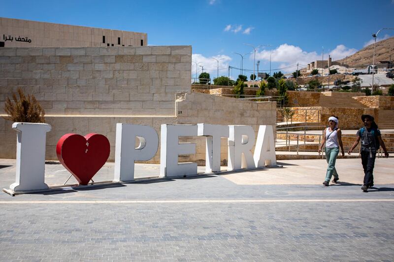 Domestic tourists arrive near the entrance of the visitors center of the reopened Petra archeological site. EPA