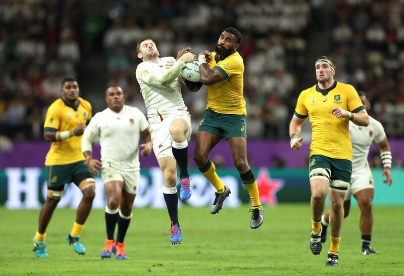 Elliot Daly of England and Marika Koroibete of Australia jump for a high ball during the Rugby World Cup 2019 Quarter Final match between England and Australia at Oita Stadium  in Oita, Japan. Getty Images