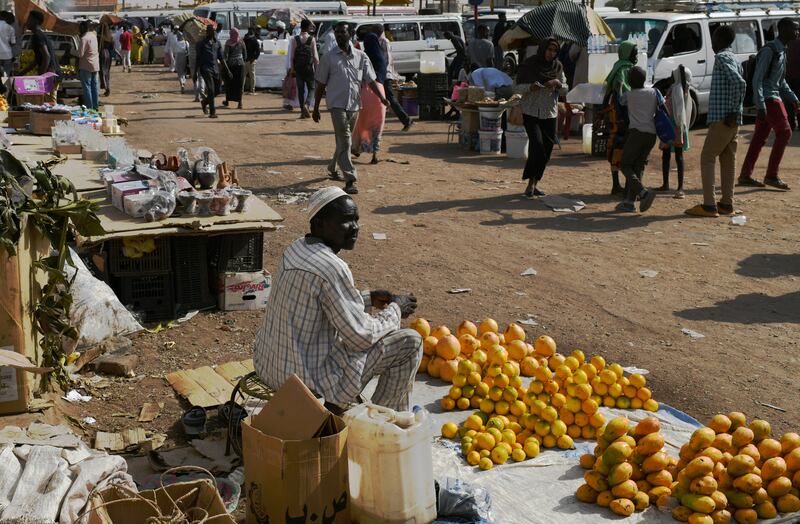 A man sells mangoes at the side of the road. EPA